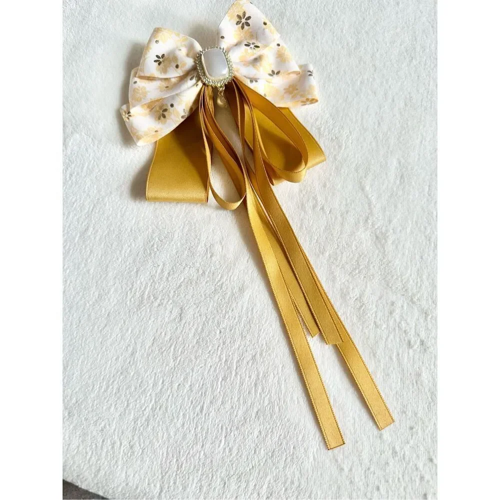 Adorable floral yellow hair bow with floral and pearl accents with hair Barrette